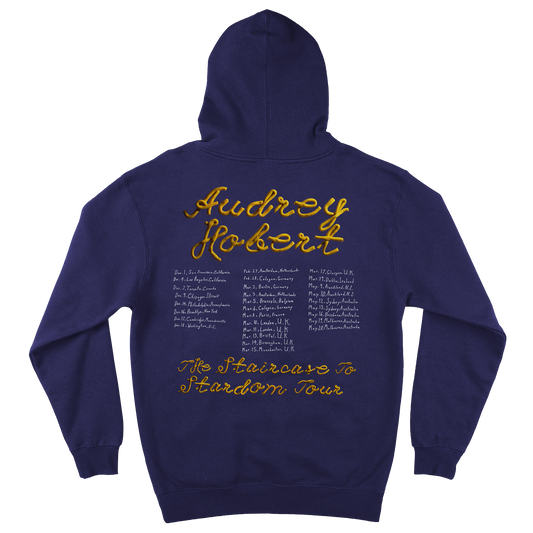 Back view of a navy hoodie featuring an Audrey Hobert 2026 tour date print across the back.