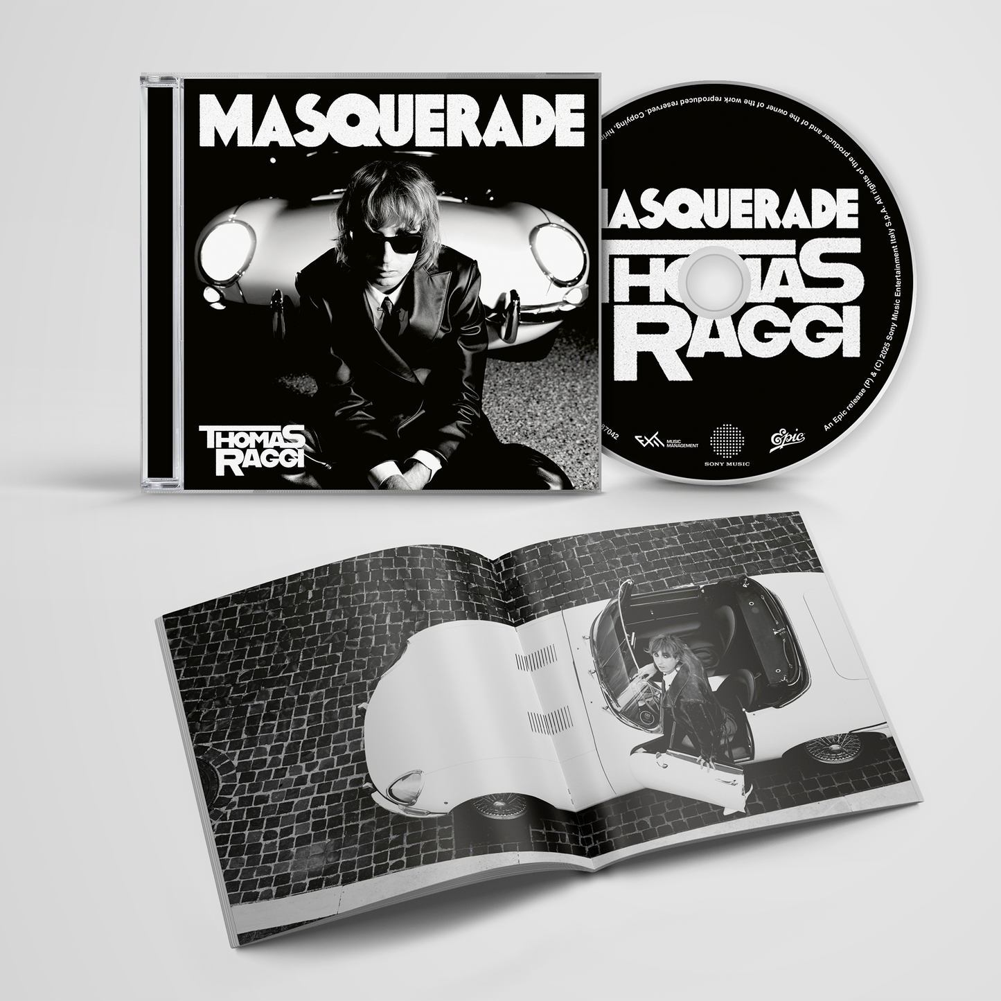 Album packaging for 'Masquerade' by Thomas Raggi with cover, CD, and booklet.