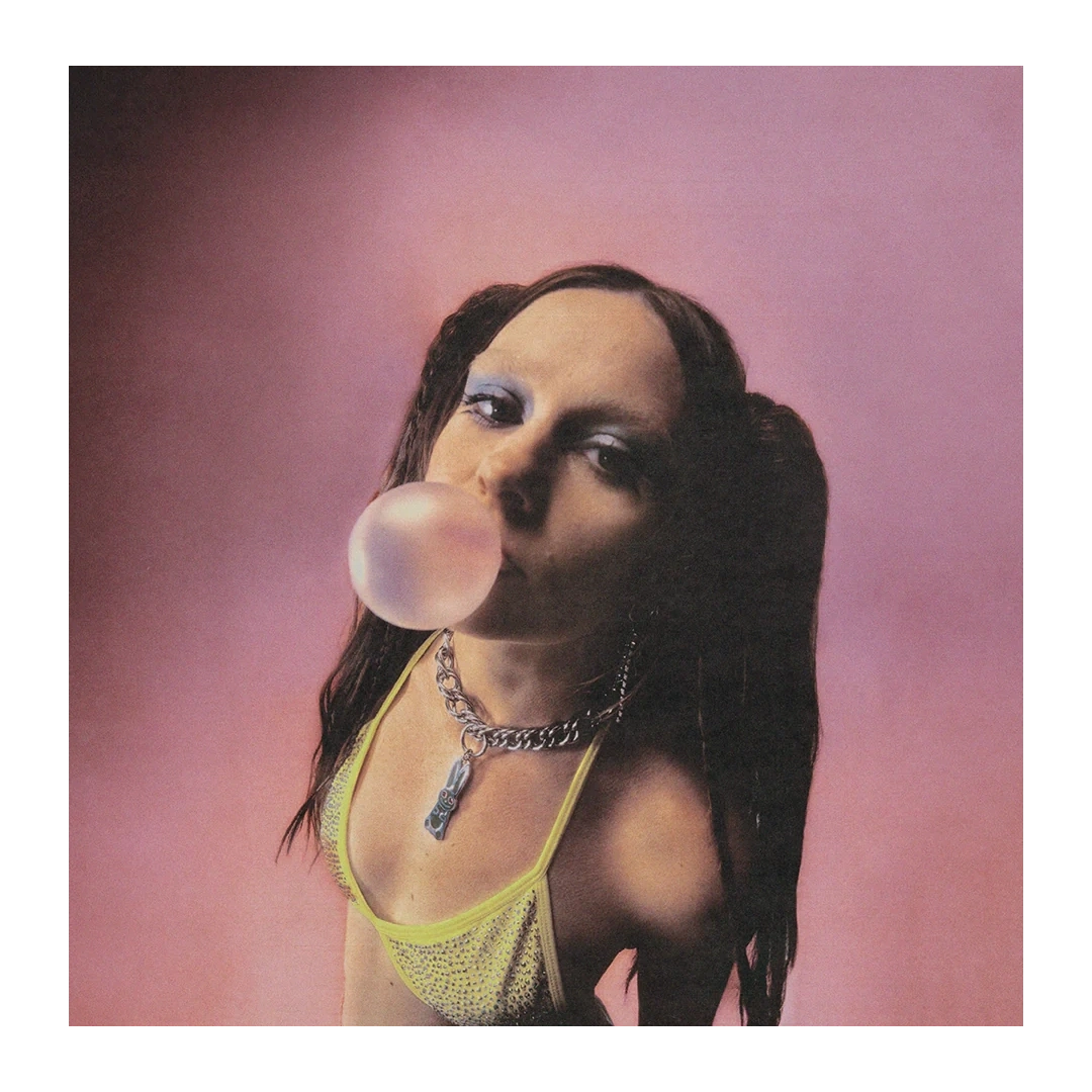 Front-facing print of Biig Piig mid-blow with bubblegum, contrasted against a bold pink background.