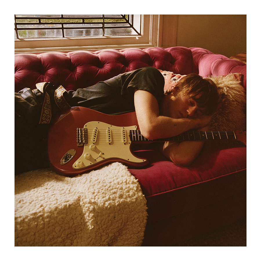 Malcolm Todd – Do That Again vinyl insert featuring artwork of Malcolm Todd lying on a red sofa holding a red strat guitar