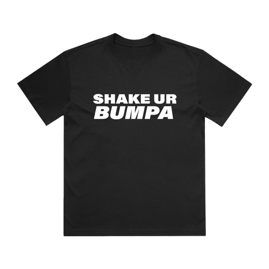 A black short-sleeve t-shirt with the phrase 'SHAKE UR BUMPA' printed in bold white capital letters across the chest.