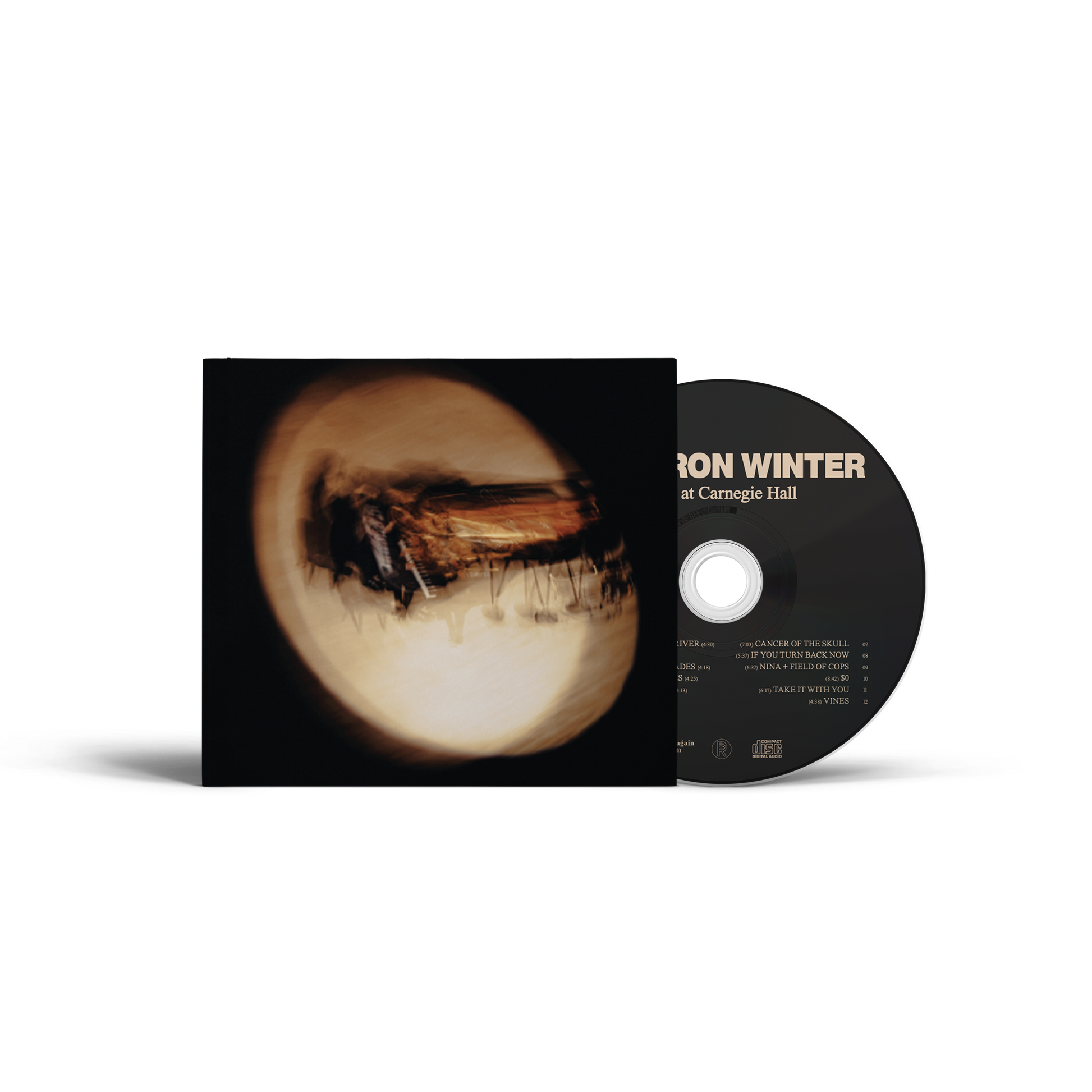 Cameron Winter's Live at Carnegie Hall CD. A CD album by Jon Winter titled 'Dark at Carnegie Hall' shown with its black sleeve and black disc.