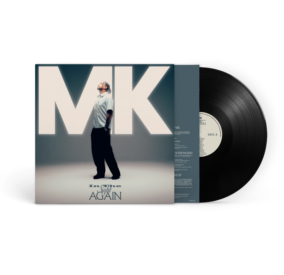 MK - In The Night Again - Vinyl. A vinyl record partially pulled from its sleeve, showing the front cover art and a black LP disc on a clean white background.
