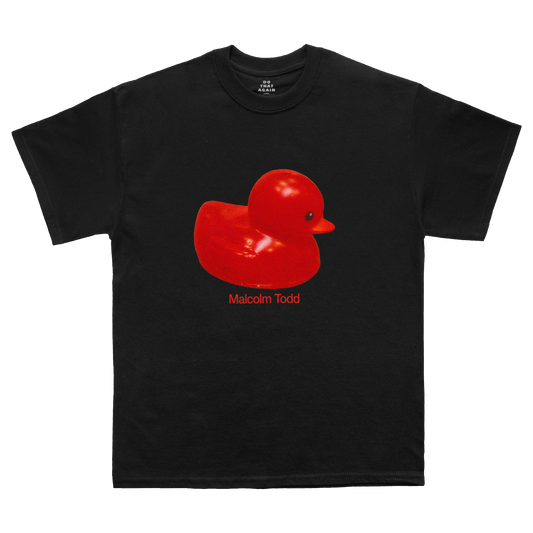 Black short-sleeve T-shirt featuring a red rubber duck graphic with "Malcolm Todd" lettering printed beneath it on the front.