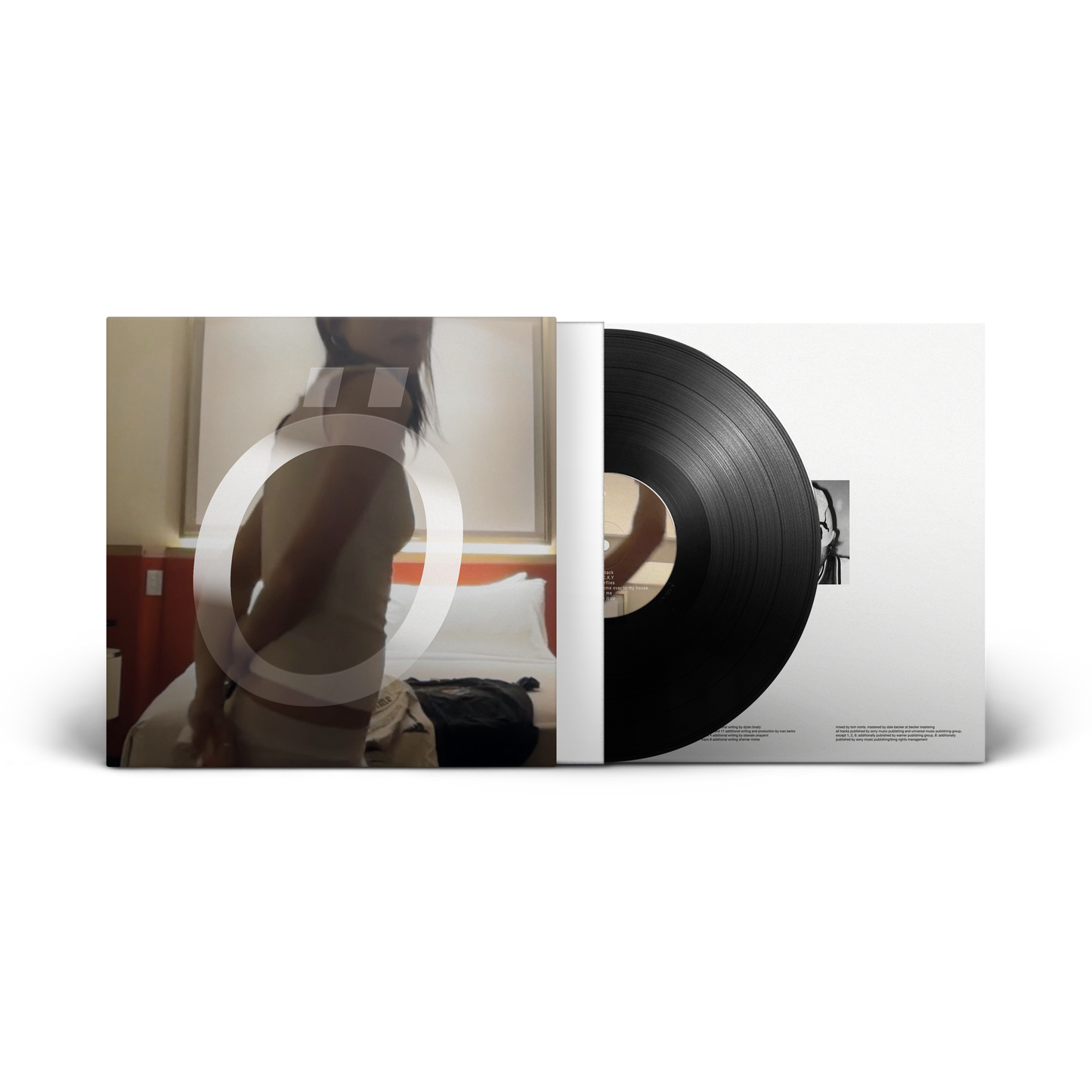 Vinyl record and cover with a room interior in the background
