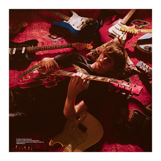 Malcolm Todd – Do That Again standard CD insert featuring Malcolm lying on the floor surrounded by guitars while playing one